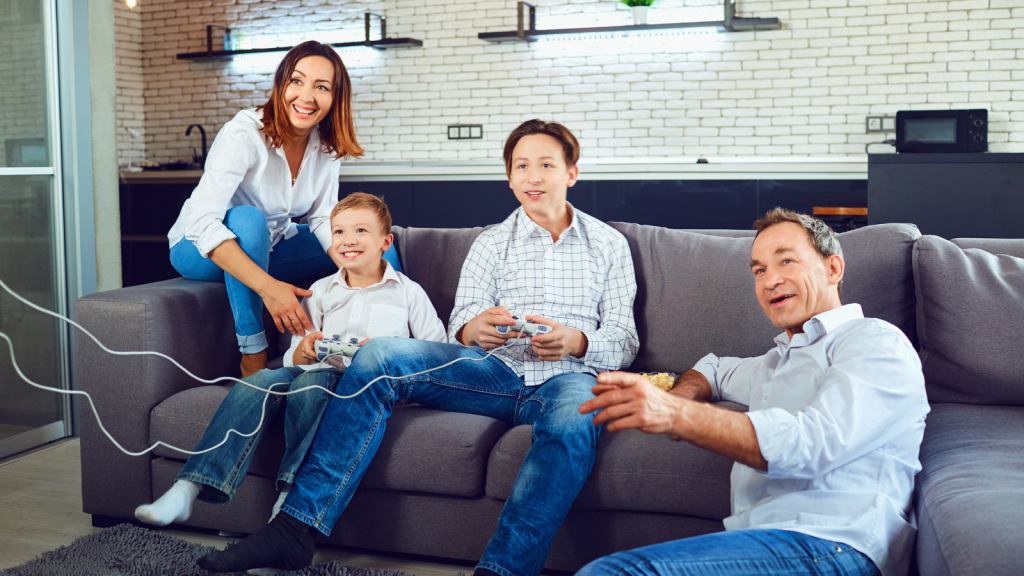 Family members Playing Video Games on sofa