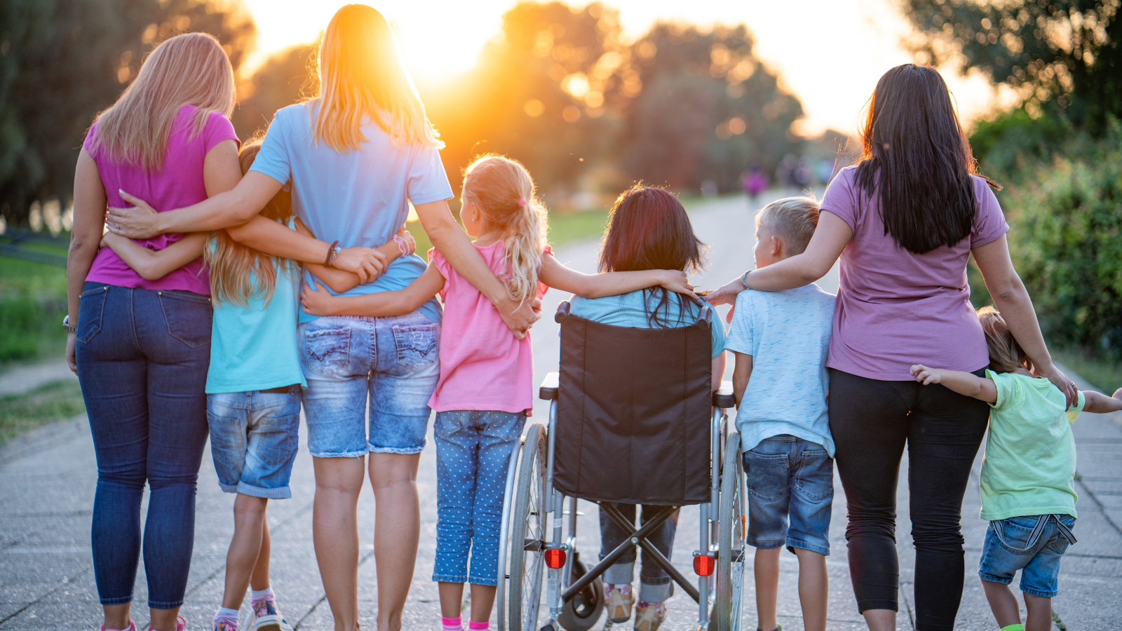 A blended family holding hands