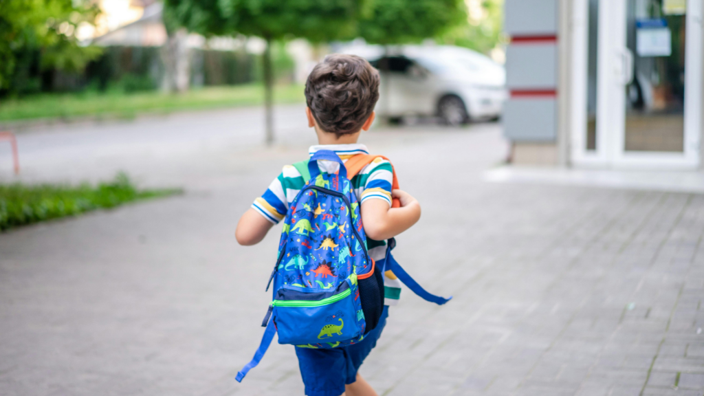 Children with a school backpack